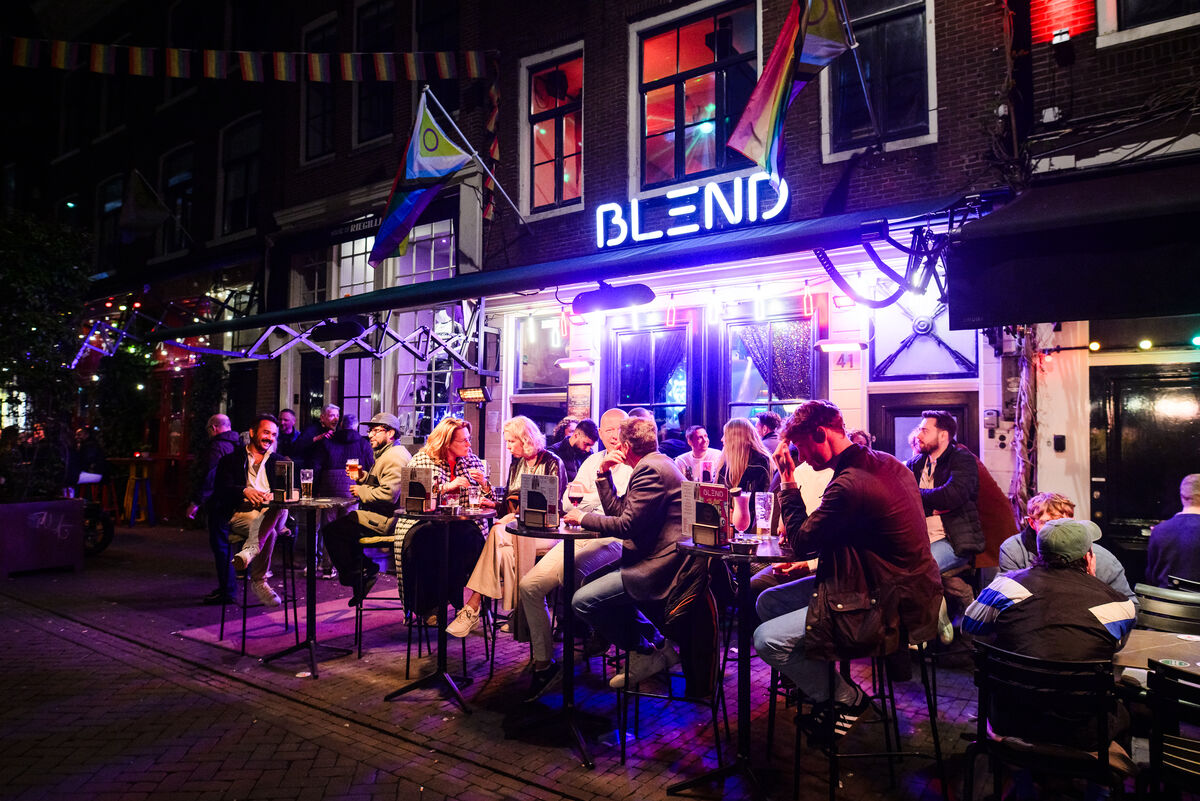 Bar Blend neon sign and busy terrace at night on Reguliersdwarsstraat Amsterdam