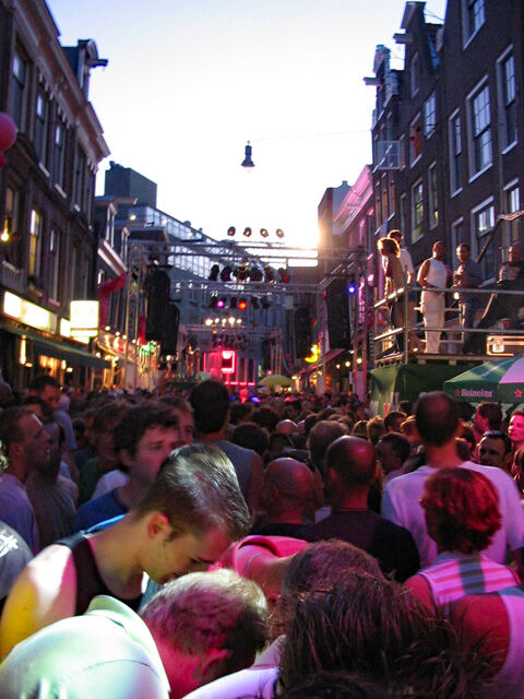 Packed Pride street party on Reguliersdwarsstraat in Amsterdam