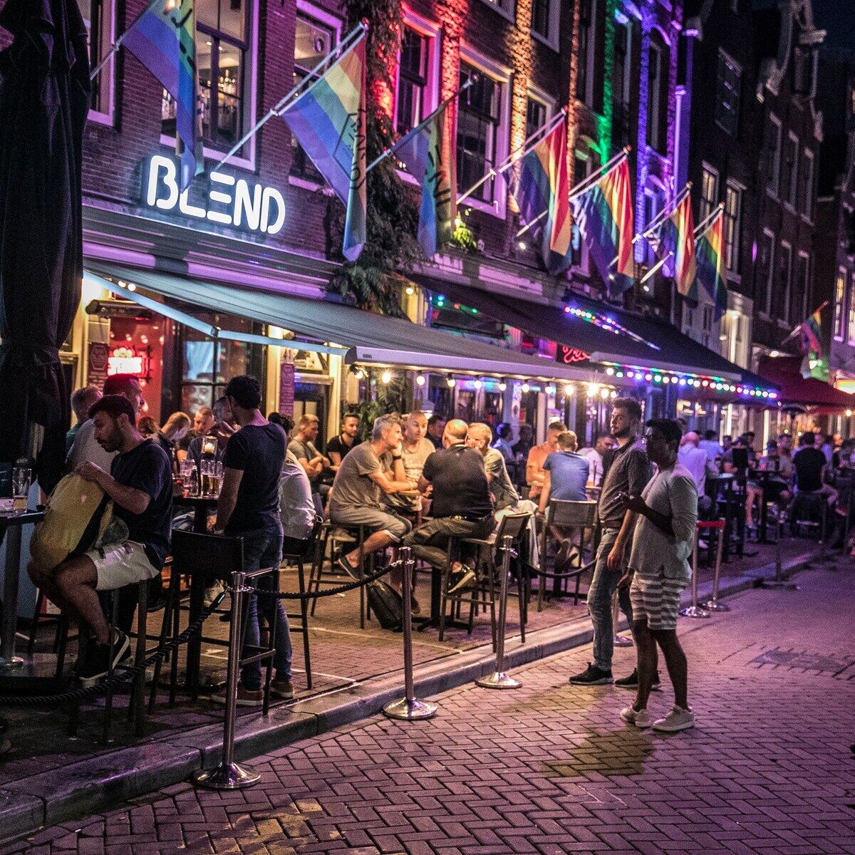 Bar Blend facade with rainbow flags and a full terrace during Pride in Amsterdam