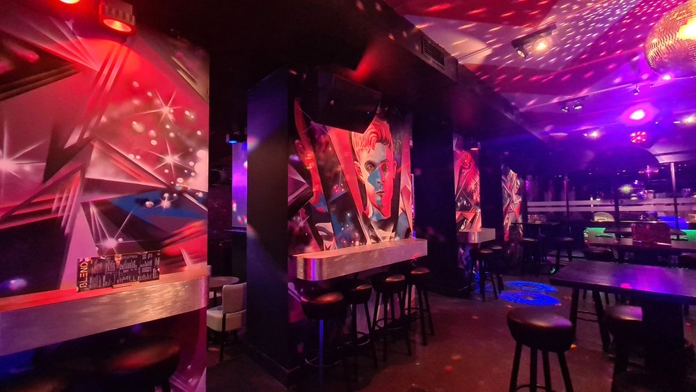 Blend XL second room with seating The second room at Blend XL Amsterdam with high tables, seating and mural-painted pillars