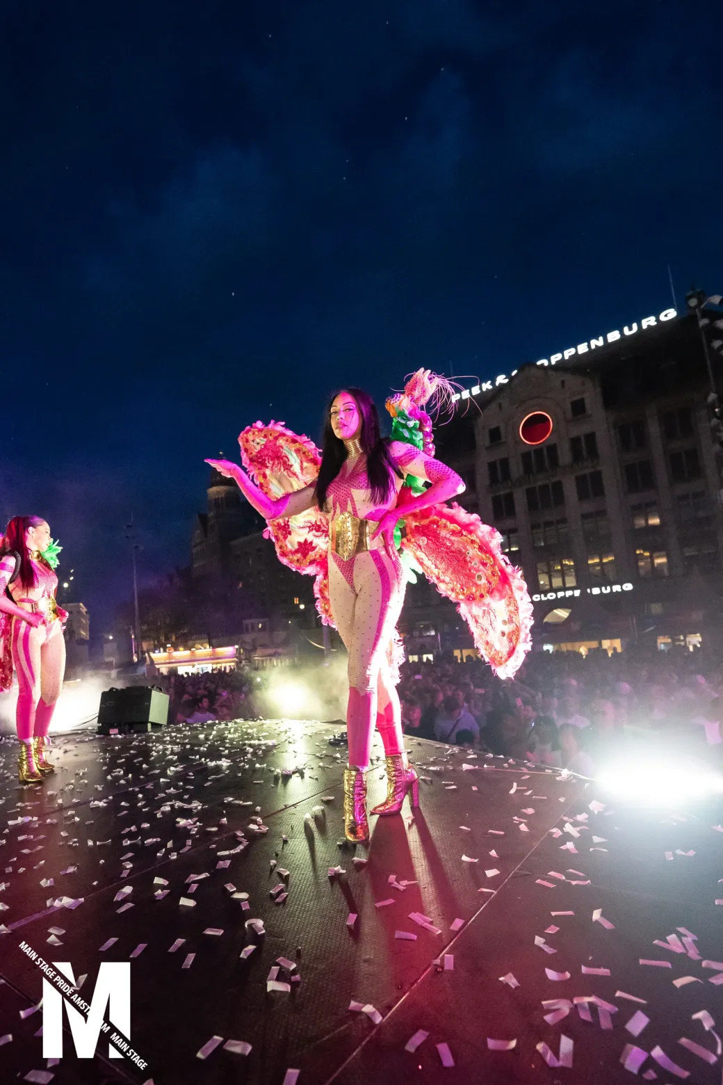 MainStage Pride stage lit up at night with confetti over the crowd on the Dam